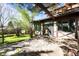 A flagstone patio area with mature trees provides a serene setting for relaxation at 1317 Birch St, Denver, CO 80220