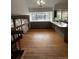 Open dining area features hardwood floors and large windows at 7863 S Harrison Cir, Centennial, CO 80122
