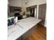Stylish kitchen with marble countertops, stainless steel appliances, and modern cabinets at 7863 S Harrison Cir, Centennial, CO 80122