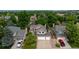 Aerial view of a large home, mature trees and manicured lawns in a well-maintained suburban neighborhood at 7176 S Pierson St, Littleton, CO 80127