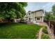 The backyard offers a spacious deck, mature landscaping, and a fenced yard, perfect for entertaining at 7176 S Pierson St, Littleton, CO 80127