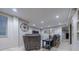 Finished basement with seating area and a view into another room at 7176 S Pierson St, Littleton, CO 80127