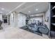Finished basement exercise room with neutral walls and carpet at 7176 S Pierson St, Littleton, CO 80127