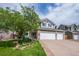 Charming two-story home featuring a well-manicured lawn and three-car garage, and delightful curb appeal at 7176 S Pierson St, Littleton, CO 80127