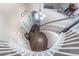 Staircase view of the foyer with hardwood floors and a pendant light fixture at 7176 S Pierson St, Littleton, CO 80127