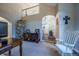 Spacious living room featuring neutral tones, archways, and a cozy seating area at 7176 S Pierson St, Littleton, CO 80127