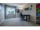 Cozy carpeted home office with neutral walls, window, and desk area at 7176 S Pierson St, Littleton, CO 80127