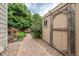 A walkway leads through the side yard and past a storage shed at 7176 S Pierson St, Littleton, CO 80127