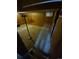 View of the partially finished basement showcasing wood paneling and old carpeting at 12058 E Virginia Pl, Aurora, CO 80012