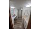 Bathroom featuring updated vanity, flooring and a glass-enclosed shower at 12058 E Virginia Pl, Aurora, CO 80012