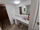 A second view of the sink and counter area in a small bathroom space at 12058 E Virginia Pl, Aurora, CO 80012