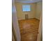 Cozy bedroom with hardwood floors and a window at 12058 E Virginia Pl, Aurora, CO 80012