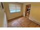 Dining area with hardwood floors, natural light, and access to the kitchen at 12058 E Virginia Pl, Aurora, CO 80012