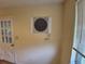Dining room featuring hardwood floors, vintage wall unit, and neutral paint color at 12058 E Virginia Pl, Aurora, CO 80012