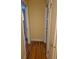 Hallway features hardwood floors and access to multiple rooms at 12058 E Virginia Pl, Aurora, CO 80012