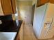 View of kitchen featuring white refrigerator with water dispenser and granite countertops at 12058 E Virginia Pl, Aurora, CO 80012