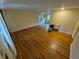 Spacious living room featuring gleaming hardwood floors and ample natural light at 12058 E Virginia Pl, Aurora, CO 80012