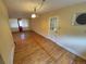 Living room with hardwood floors, window views, and vintage light fixtures at 12058 E Virginia Pl, Aurora, CO 80012