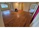 Open living area with hardwood floors, neutral paint, and bright natural light at 12058 E Virginia Pl, Aurora, CO 80012