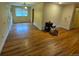 Bright living room with hardwood floors, neutral walls, and a large window at 12058 E Virginia Pl, Aurora, CO 80012
