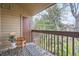 Cozy balcony features a wooden chair, stylish rug, and a pleasant outdoor view at 324 Wright St # 304, Lakewood, CO 80228