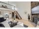 Bright open-concept living room with vaulted ceilings, fireplace, wood floors and plenty of natural light at 324 Wright St # 304, Lakewood, CO 80228
