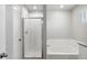 Bathroom featuring a shower, soaking tub, and modern fixtures at 7322 Green River Ave, Frederick, CO 80530
