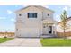 Charming two-story home featuring a two-car garage, well-maintained lawn, and classic architectural details at 7322 Green River Ave, Frederick, CO 80530