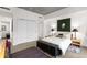 Bright bedroom with large windows, and sliding door to closet at 1620 Little Raven St # 109, Denver, CO 80202