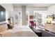 Spacious bedroom with large windows, sitting area, and wood dresser at 1620 Little Raven St # 109, Denver, CO 80202