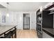 Gourmet kitchen with stainless appliances, dining area, and modern finishes at 1620 Little Raven St # 109, Denver, CO 80202