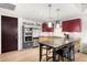 Modern kitchen with L-shaped island and stainless steel appliances at 1620 Little Raven St # 109, Denver, CO 80202