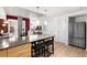 Open concept kitchen with breakfast bar and stainless steel appliances at 1620 Little Raven St # 109, Denver, CO 80202