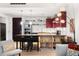 Modern kitchen featuring stainless steel appliances, an island with seating, and designer lighting at 1620 Little Raven St # 109, Denver, CO 80202