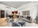Bright living area with an open kitchen, modern décor, and lots of natural light at 1620 Little Raven St # 109, Denver, CO 80202