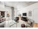 Living room featuring exposed ceilings, open layout, and minimalist design elements at 1620 Little Raven St # 109, Denver, CO 80202