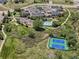 Aerial view showcases the community clubhouse, pool, golf, and tennis amenities at 21416 E Ottawa Cir, Aurora, CO 80016