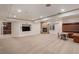 Spacious finished basement featuring a stone fireplace and built-in seating area at 21416 E Ottawa Cir, Aurora, CO 80016