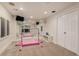 Basement room with mirrored wall and ballet bar, and a glimpse of a bar through glass doors at 21416 E Ottawa Cir, Aurora, CO 80016