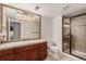 Tiled bathroom with a glass shower and updated fixtures at 21416 E Ottawa Cir, Aurora, CO 80016