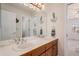 This bathroom features a double sink vanity, a large mirror, and nautical-themed decor at 21416 E Ottawa Cir, Aurora, CO 80016