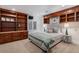 Cozy bedroom with custom built-ins and a comfortable king-sized bed at 21416 E Ottawa Cir, Aurora, CO 80016