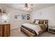This is a bedroom that is decorated with a bed that has a decorative headboard and a ceiling fan at 21416 E Ottawa Cir, Aurora, CO 80016