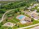 Aerial view of community pool, playground, and green spaces offers leisure and recreation at 21416 E Ottawa Cir, Aurora, CO 80016