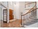 Bright foyer with a curved staircase, hardwood floors, and decorative lighting at 21416 E Ottawa Cir, Aurora, CO 80016