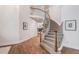 Grand foyer with a curved staircase, hardwood floors, and elegant decor at 21416 E Ottawa Cir, Aurora, CO 80016