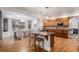 Open kitchen with a center island, wood cabinets, and a view of the dining area at 21416 E Ottawa Cir, Aurora, CO 80016