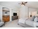A beautifully designed main bedroom features a tray ceiling, a ceiling fan, and a private ensuite bath at 21416 E Ottawa Cir, Aurora, CO 80016