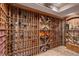 Well-stocked wine cellar with custom wooden racking for organized bottle storage, creating a collector's dream at 21416 E Ottawa Cir, Aurora, CO 80016