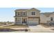 Charming two-story home with a blend of stone and siding, complemented by a well-manicured lawn at 15296 Fillmore St, Thornton, CO 80602